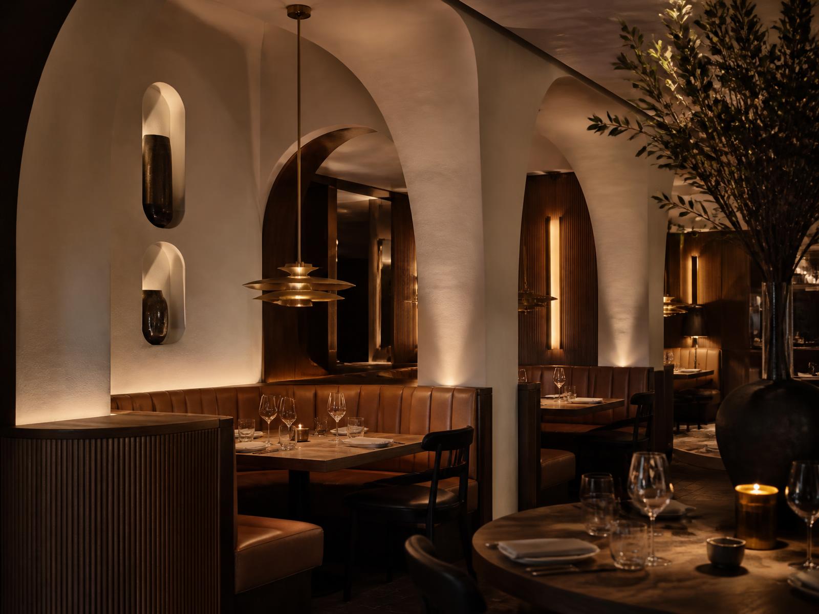 Restaurant interior design in Gilbert Arizona with plaster arches and leather banquettes